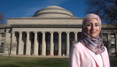 Omaima stands before MIT Building 10 dome