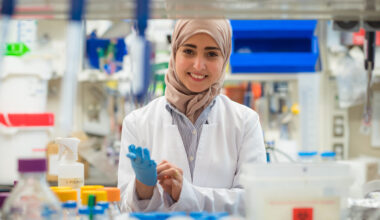 Photo of Dr. Eman Ageely at her lab bench