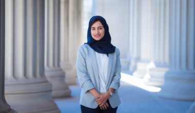 Maha stands in front of MIT columns