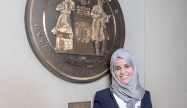 Haleema stands before MIT Seal